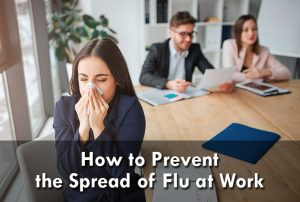 Sick young woman with the common flu sit saparately at work table in office meeting room and sneezing. She hold white napkin. Her colleagues work behind.